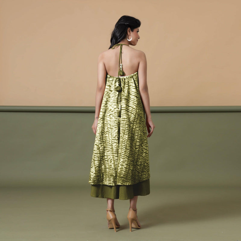 Back View of a Model wearing Convertible Olive Green Shibori Tie Dye 6-Way Skirt Dress