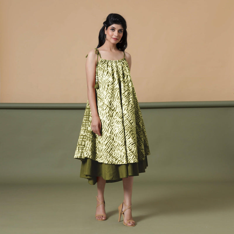 Right View of a Model wearing Convertible Olive Green Shibori Tie Dye 6-Way Skirt Dress