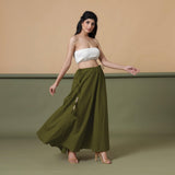 Right View of a Model wearing Convertible Olive Green Shibori Tie Dye 6-Way Skirt Dress