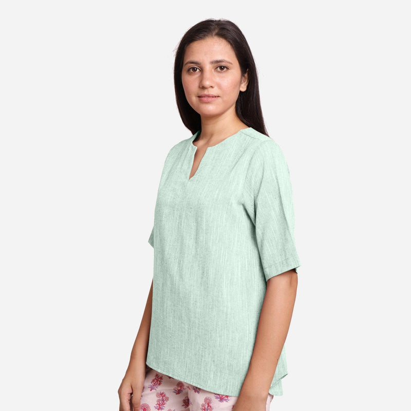 Left View of a Model wearing Aqua 100% Cotton High Low Tunic Top