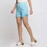 Left View of a Model wearing Aqua Blue Tie-Dye Cotton Elasticated Short Shorts