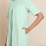 Front Detail of a Model wearing Cotton Aqua Box Pleated Jumpsuit