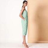 Right View of a Model wearing Aqua Sleeveless Cotton Button-Down Midi Jumpsuit