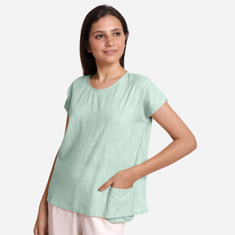 Left View of a Model wearing Aqua 100% Cotton Boat Neck A-Line Top