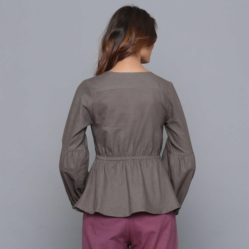 Back View of a Model wearing Ash Grey V-Neck Flannel Peplum Top