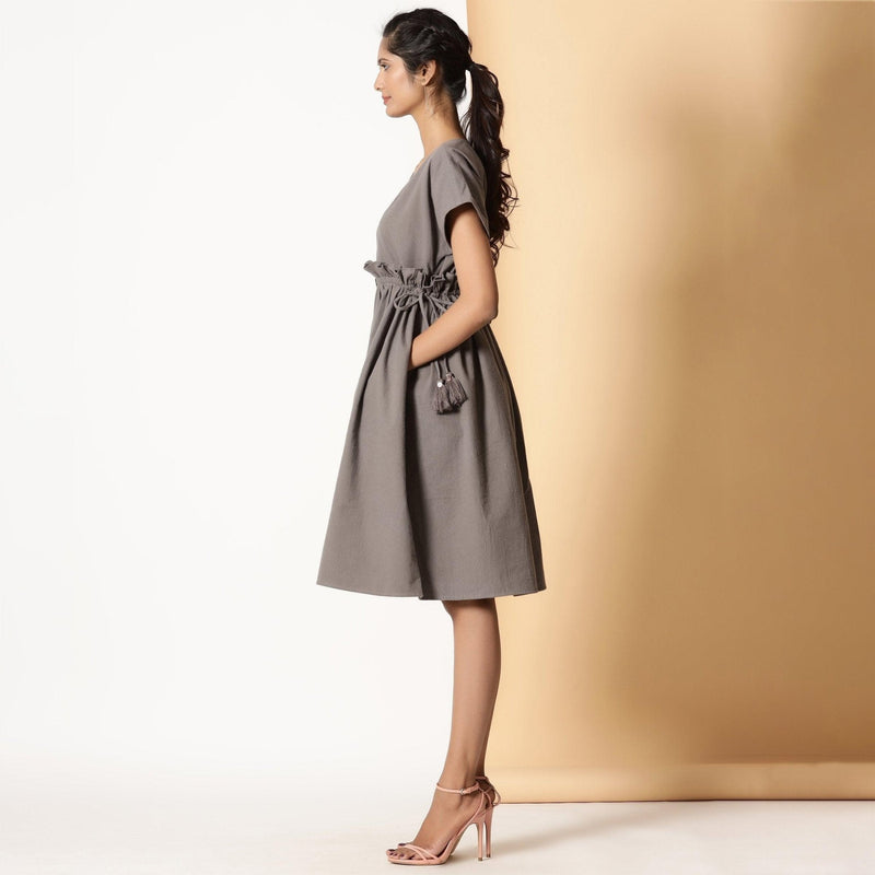 Left View of a Model wearing Warm Ash Grey Flannel Bohemian Frilled Dress