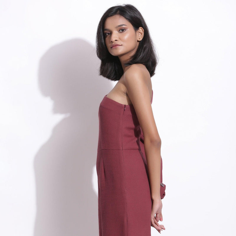 Left View of a Model wearing Barn Red Honeycomb One-Shoulder Jumpsuit