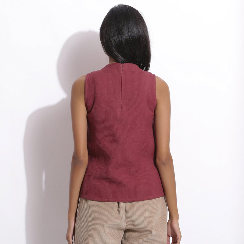 Back View of a Model wearing Barn Red Cotton Waffle Funnel Neck Top