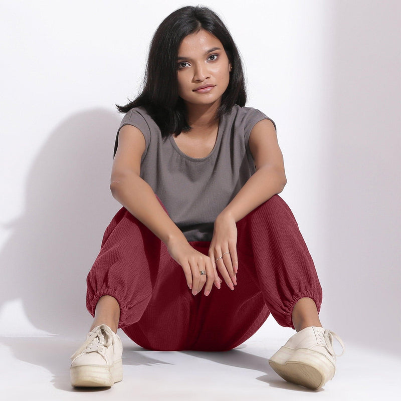 Front View of a Model wearing Comfy Barn Red Cotton Waffle Jogger Pants