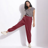 Front View of a Model wearing Comfy Barn Red Cotton Waffle Jogger Pants