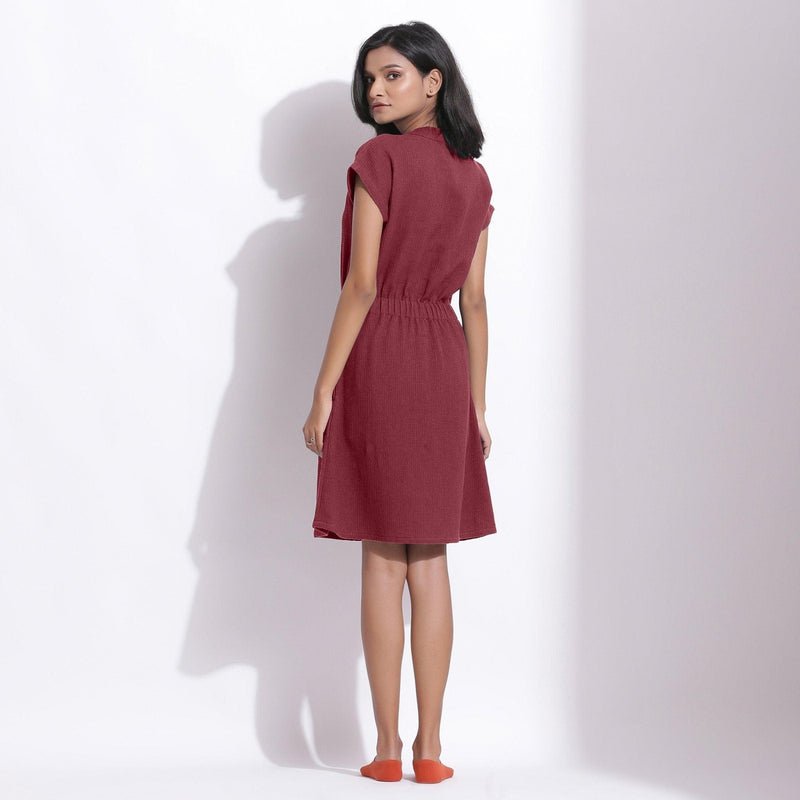 Back View of a Model wearing Cotton Waffle Barn Red Button-Down Dress