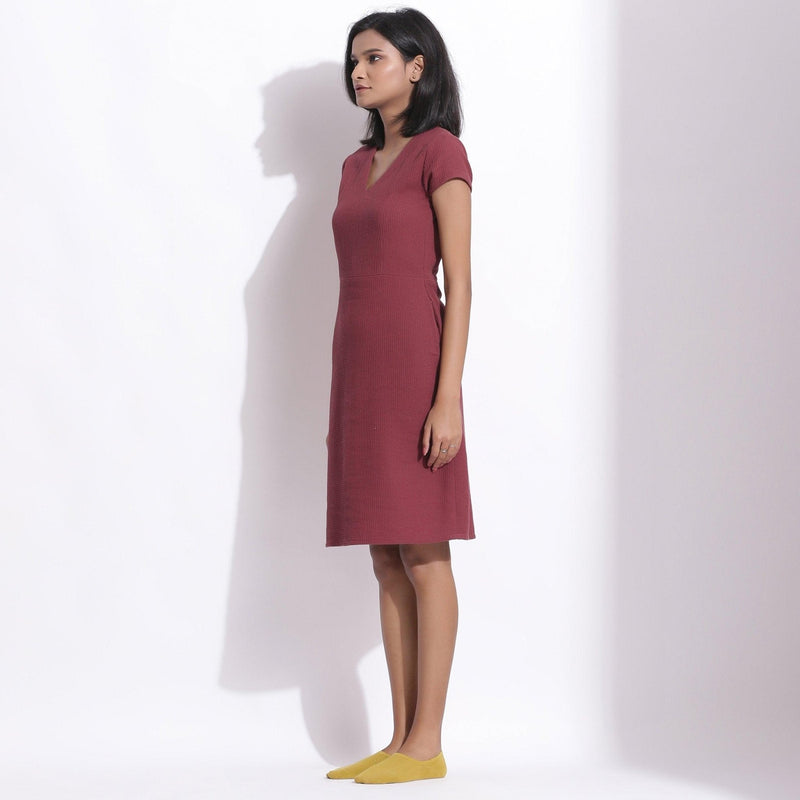 Left View of a Model wearing Barn Red Cotton Waffle V-Neck Dress