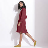 Right View of a Model wearing Barn Red Cotton Waffle Turtleneck Dress