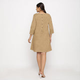 Back View of a Model wearing Beige Yoked Cotton Tunic Dress