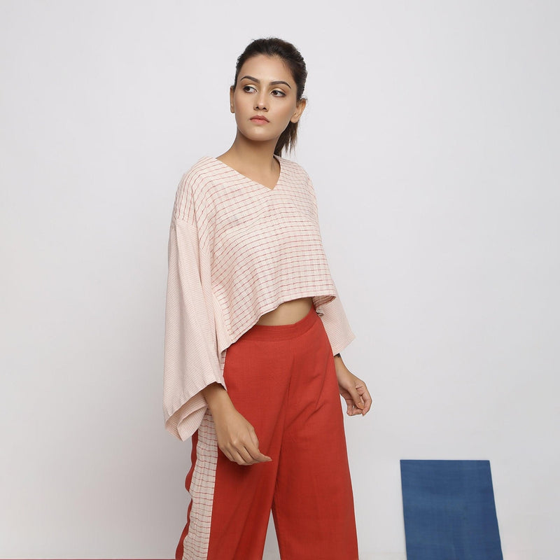 Right View of a Model wearing Pink Vegetable Dyed V-Neck Crop Top