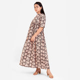 Left View of a Model wearing Beige Bagru Printed Floral Flared Dress