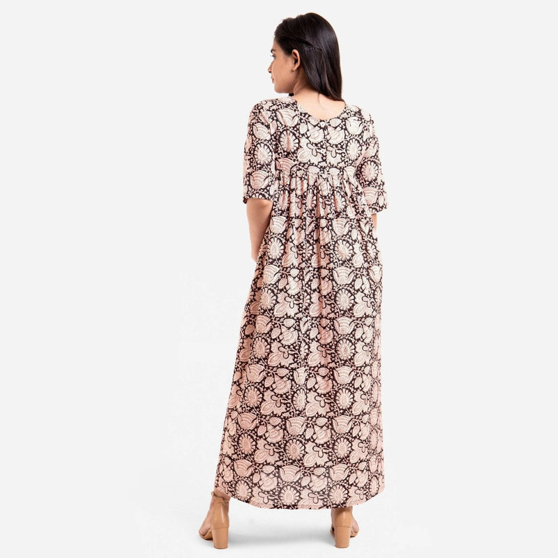 Back View of a Model wearing Beige Bagru Block Print Cotton Flared Maxi Dress