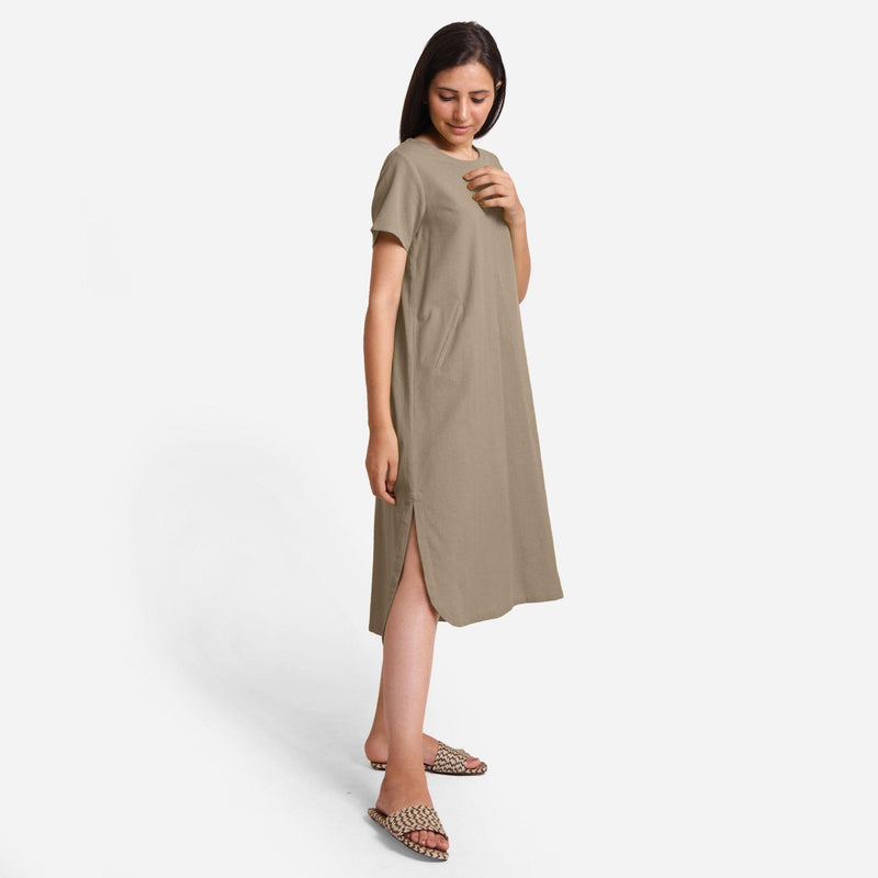 Right View of a Model wearing Beige Cotton Welt Pocket Shift Dress