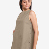 Left Detail of a Model wearing Beige Cotton Flax Kangaroo Pocket Dress