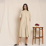 Front View of a Model wearing Cotton Beige Box Pleated Jumpsuit