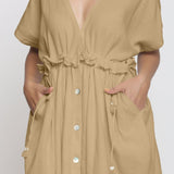 Front Detail of a Model wearing Beige Deep Neck Bohemian Frilled Dress