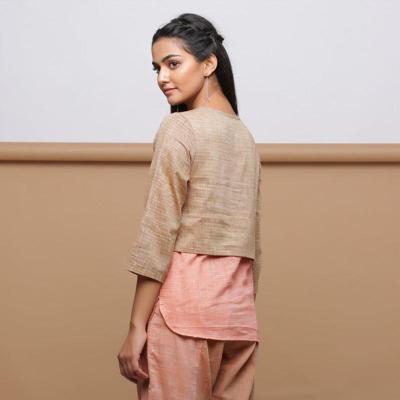 Back View of a Model wearing Handspun Beige Yoked Round Hem Top