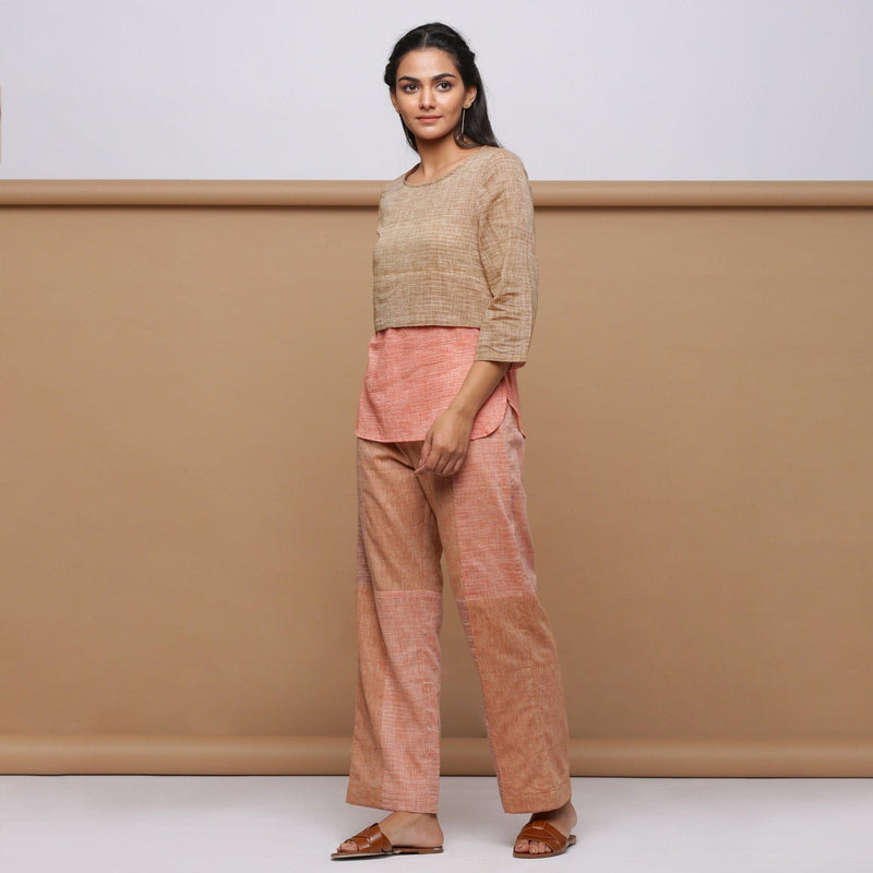 Left View of a Model wearing Handspun Beige Yoked Round Hem Top