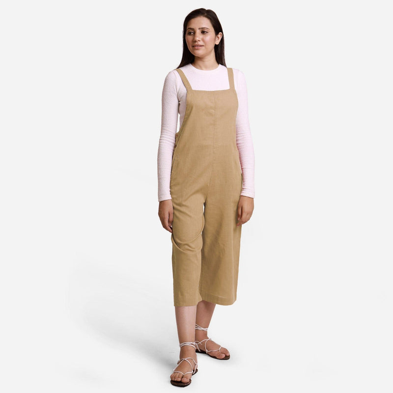 Front View of a Model wearing Beige Pinafore Midi Length Dungaree