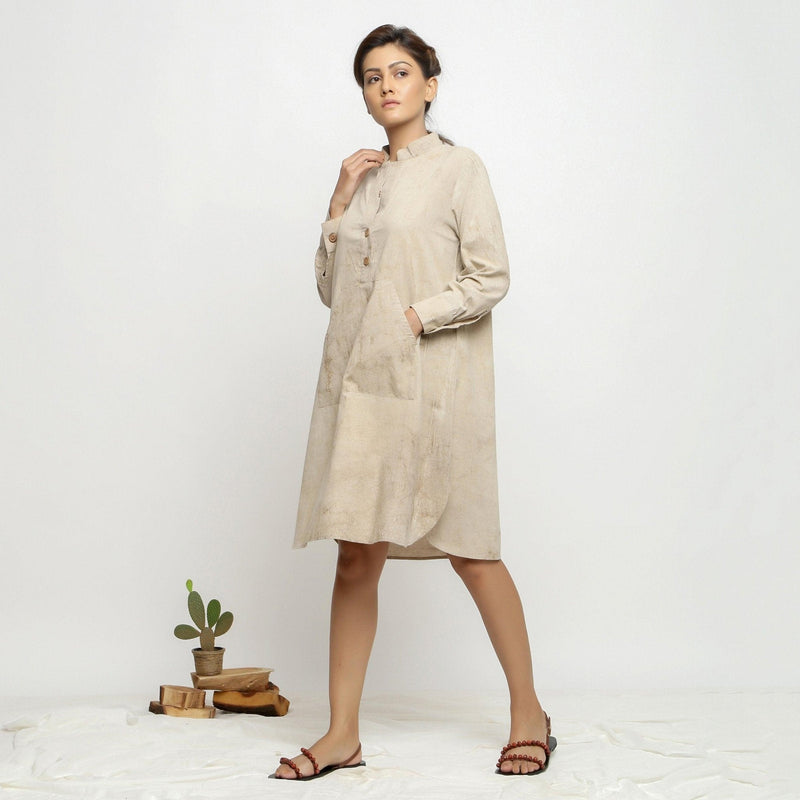 Left View of a Model wearing Beige Dabu Hand-Lep Cotton Knee Length Shirt Dress