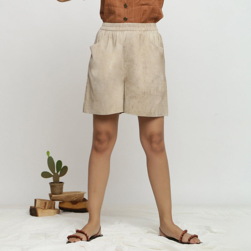 Front View of a Model wearing Beige Dabu Print Cotton Flared Shorts