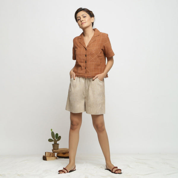 Front View of a Model wearing Beige Dabu Print Cotton Flared Shorts