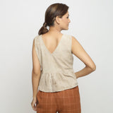 Back View of a Model wearing Beige Dabu Printed Sleeveless Gathered Top