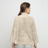 Back View of a Model wearing Dabu Printed Natural Dyed Beige Top