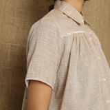 Right Detail of a Model wearing Beige Handspun Comfort Fit Balloon Top