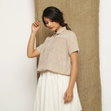 Left View of a Model wearing Beige Handspun Comfort Fit Balloon Top