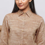 Front Detail of a Model wearing Beige Handspun Cotton Muslin Button-Down Short Shirt