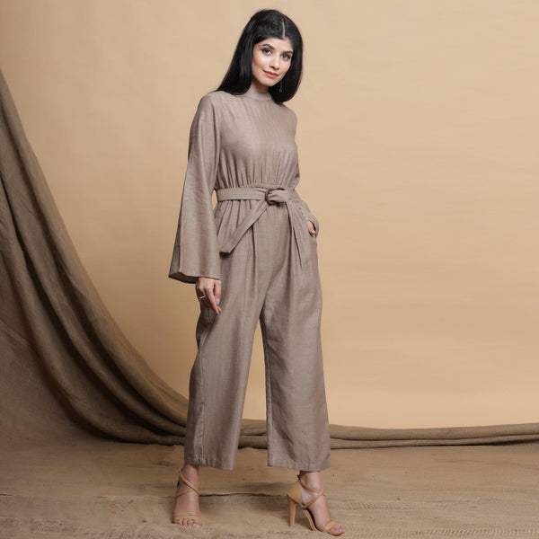 Right View of a Model wearing Beige Flared Sleeve Gathered Jumpsuit