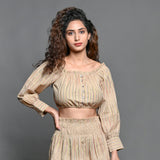 Front View of a Model wearing Beige Handwoven Cotton Frilled Blouson Crop Top