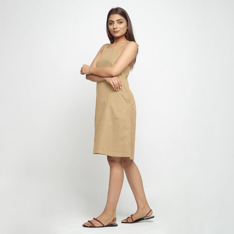 Left View of a Model wearing Beige Criss-Cross Cotton A-Line Dress