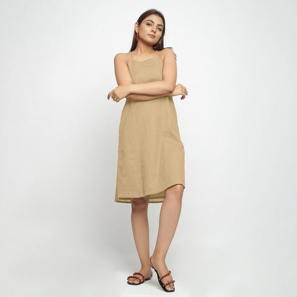 Front View of a Model wearing Beige Criss-Cross Cotton A-Line Dress