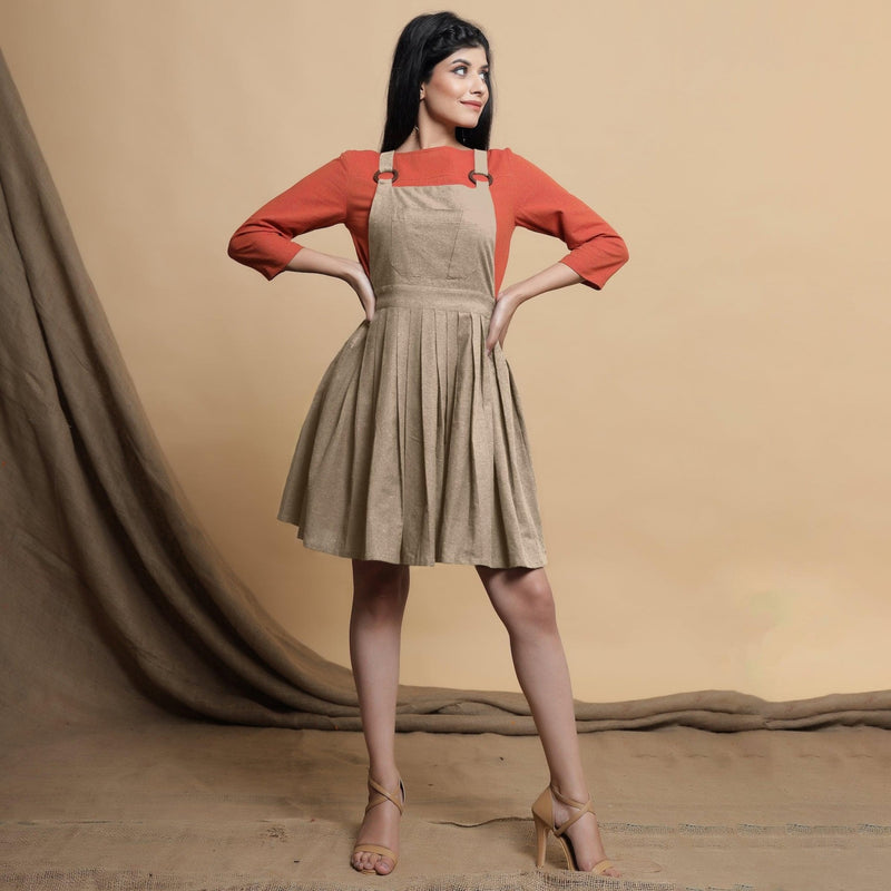 Front View of a Model wearing Beige Pleated Cotton Flax Knee Length Criss-Cross Back Dress