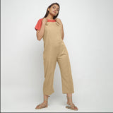 Front View of a Model wearing Beige Strap Sleeve Solid Dungaree