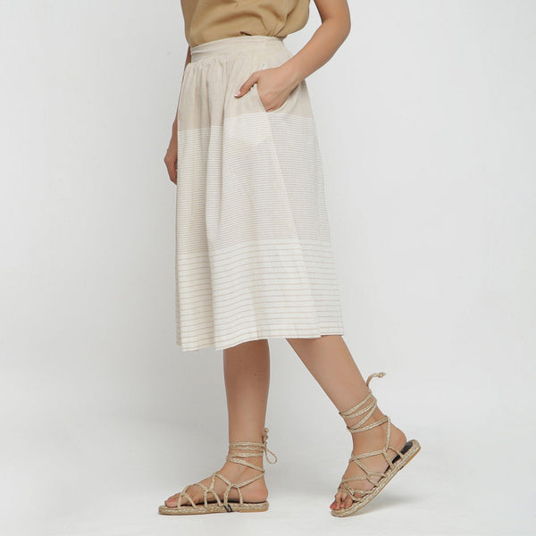 Left View of a Model wearing Striped Pleated High Rise Paneled Skirt