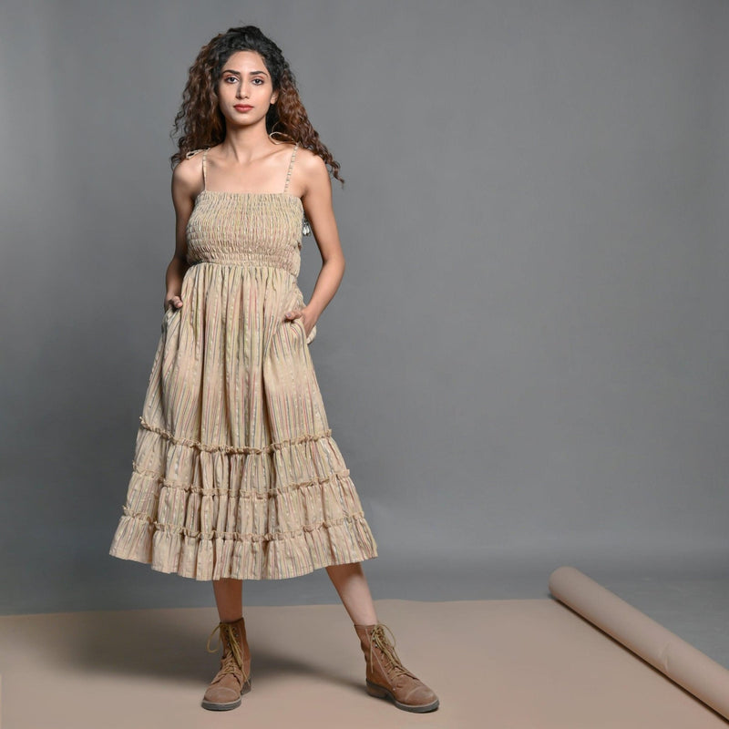 Front View of a Model wearing Beige Striped Handwoven Cotton Boho Tier Dress