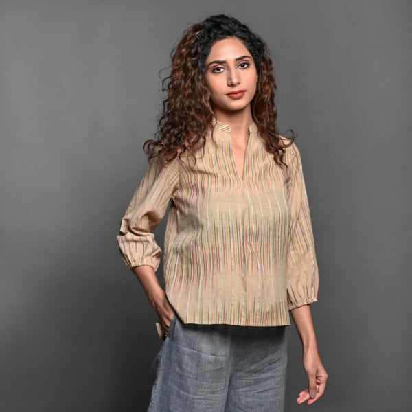 Front View of a Model wearing Beige Striped Handwoven Cotton Split Neck Pleated Shirt