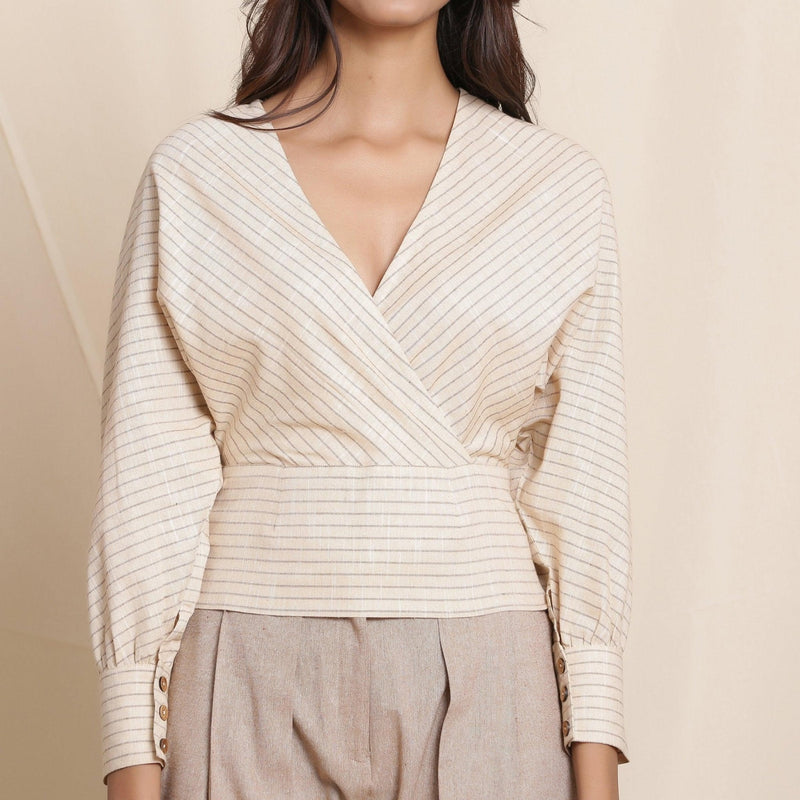 Front Detail of a Model wearing Beige Striped Surplice Neck Cotton Blouson Wrap Top