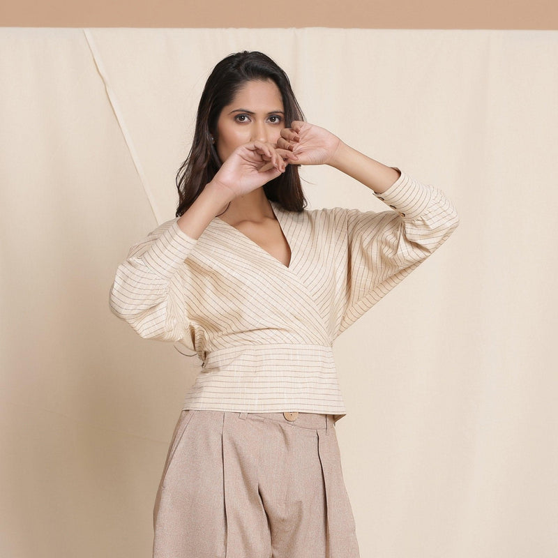 Right View of a Model wearing Beige Striped Surplice Neck Cotton Blouson Wrap Top