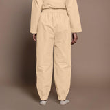 Back View of a Model wearing Beige Warm Cotton Flannel Elasticated High-Rise Jogger Pant