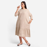 Front View of a Model wearing Beige Yarn-Dyed 100% Cotton Tier Midi Dress