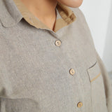 Front Detail of a Model wearing Beige Yarn Dyed Knife Pleats Top